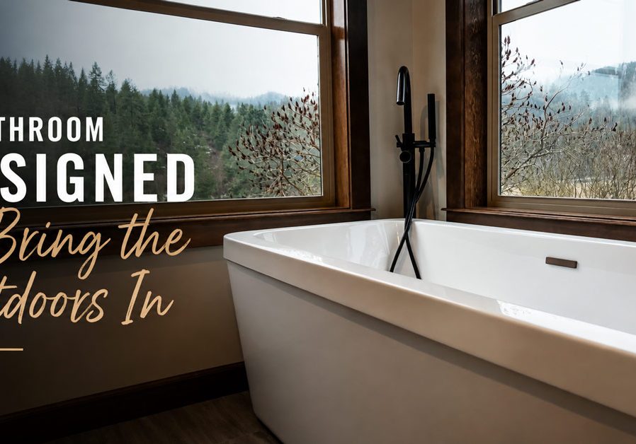 Modern white freestanding bathtub near large wood-framed windows overlooking a misty forest with text overlay "A Bathroom Designed to Bring the Outdoors In"